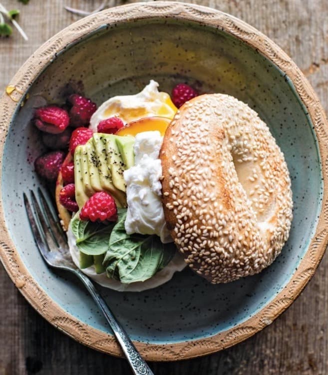 Sesame Bagels with Avocado, Burrata, and Raspberries